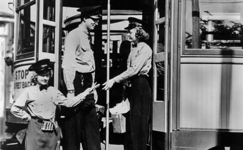 Female streetcar driver and conductor in training